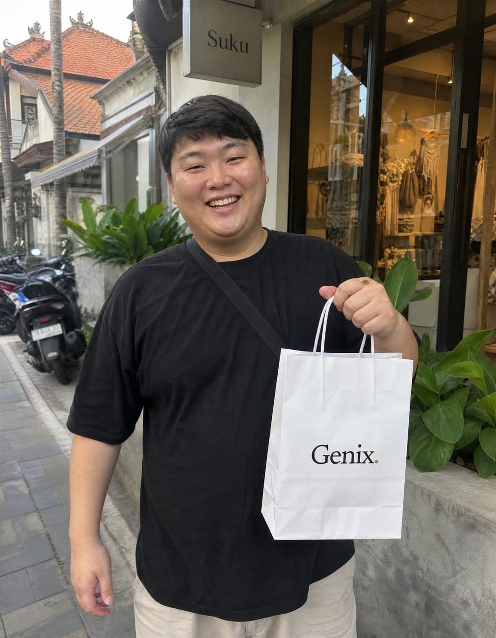 A Genix customer in Bali receiving their sealed delivery parcel