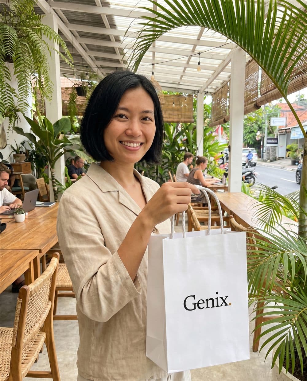 A Genix customer in Bali receiving their sealed delivery parcel