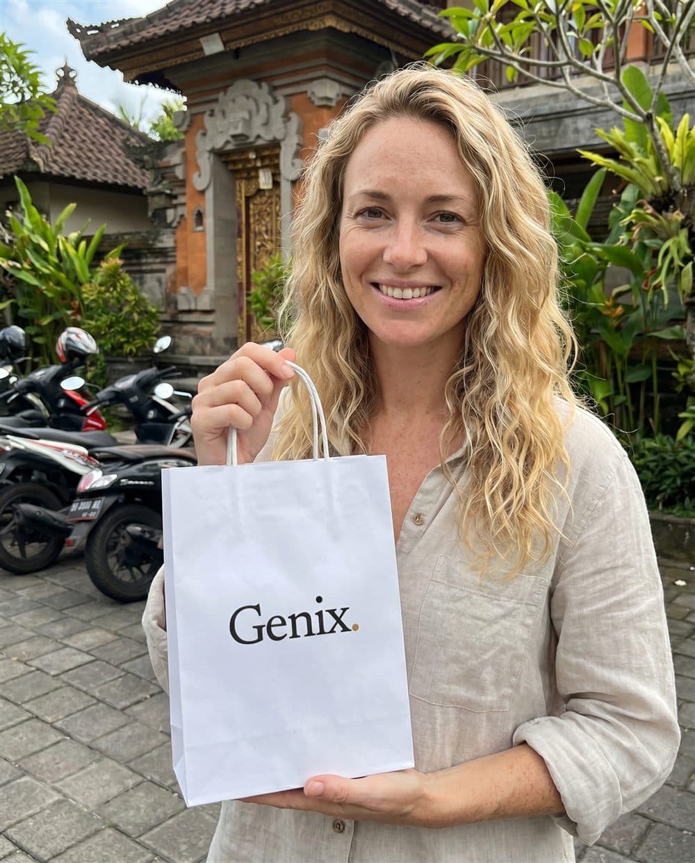 A Genix customer in Bali receiving their sealed delivery parcel
